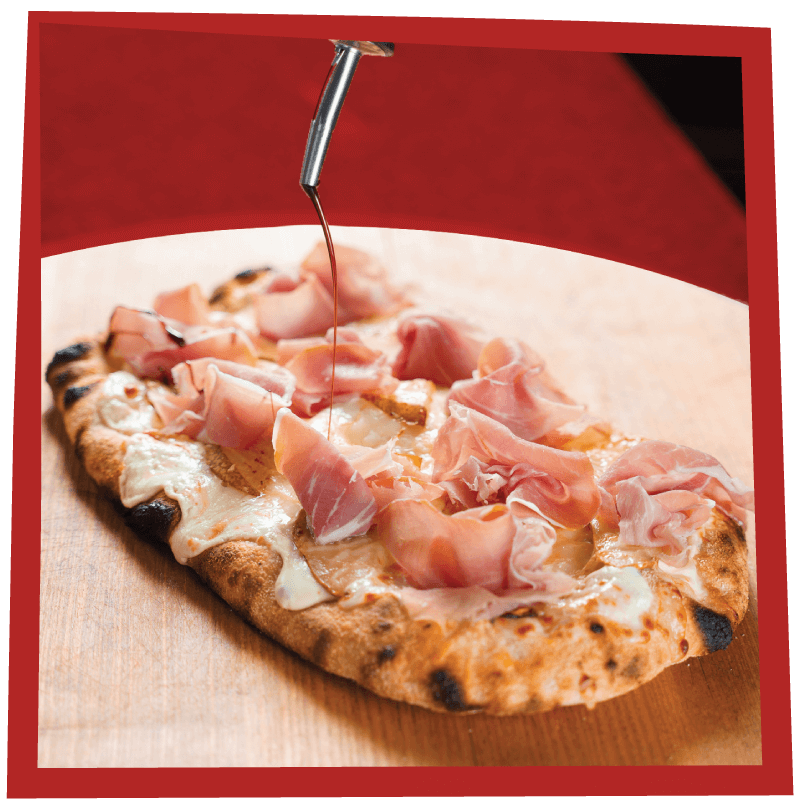 Making an EPICO Pinsa Romana pizza with a drizzle of olive oil